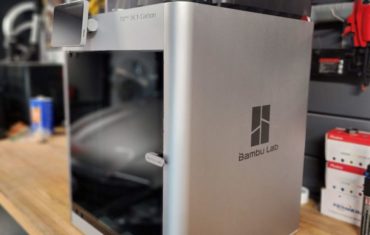 This image is an overall view of the Bambu Lab X1 Carbon 3D printer with the AMS system mounted on top.